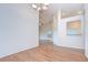 Bright dining area with hardwood floors and a chandelier near an archway at 34907 Double Eagle Ct, Zephyrhills, FL 33541