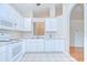 Functional kitchen featuring white appliances and ample cabinet space at 34907 Double Eagle Ct, Zephyrhills, FL 33541