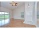 Inviting living room featuring hardwood floors, natural light, and sliding glass doors at 34907 Double Eagle Ct, Zephyrhills, FL 33541