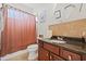 Bathroom featuring a granite countertop and a shower with a decorative curtain at 3709 W Horatio St, Tampa, FL 33609