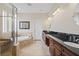 Serene bathroom featuring double vanity, garden tub, and glass shower enclosure at 3709 W Horatio St, Tampa, FL 33609
