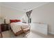 Comfortable bedroom featuring an ornate side table and a large, bright window at 3709 W Horatio St, Tampa, FL 33609