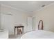 Neutral bedroom with a long mirror and an ornamental antique side table at 3709 W Horatio St, Tampa, FL 33609