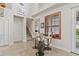 Bright dining area with high ceilings features a round table and wooden shuttered window at 3709 W Horatio St, Tampa, FL 33609