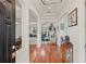 Inviting foyer leads into a spacious home showcasing tray ceilings, arched entryways, and gleaming hardwood floors at 3709 W Horatio St, Tampa, FL 33609