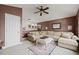 Cozy living room featuring a large sofa, rug, and decorations at 3709 W Horatio St, Tampa, FL 33609