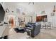 Bright and airy living room featuring tall ceilings, open floor plan, stylish bar, and upscale finishes at 3709 W Horatio St, Tampa, FL 33609