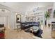 Bright living room featuring tall ceilings, recessed lighting, tile flooring, and comfortable furnishings at 3709 W Horatio St, Tampa, FL 33609