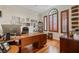 Charming home office with wood floors, built-in shelving, and arched window at 3709 W Horatio St, Tampa, FL 33609