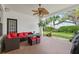 Covered patio with outdoor seating and views of the landscaped backyard at 3709 W Horatio St, Tampa, FL 33609