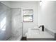 Beautiful bathroom with tiled shower, new vanity and fixtures at 3710 W Griflow St, Tampa, FL 33629