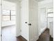 Hallway view to bedroom, closet, and bathroom with marble shower at 3710 W Griflow St, Tampa, FL 33629
