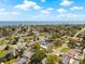 Aerial view of the neighborhood with a home near the water at 3860 Whiting Se Dr, St Petersburg, FL 33705