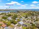 Community aerial view showcasing bay view, modern homes and neighborhood parks near Downtown St Pete at 3860 Whiting Se Dr, St Petersburg, FL 33705