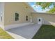 The backyard features a large concrete patio perfect for outdoor entertaining at 3860 Whiting Se Dr, St Petersburg, FL 33705