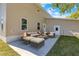 The backyard features a concrete patio complete with outdoor seating at 3860 Whiting Se Dr, St Petersburg, FL 33705