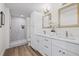Stylish bathroom with dual vanity, modern fixtures, and a spacious walk-in shower at 3860 Whiting Se Dr, St Petersburg, FL 33705
