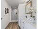 Elegant bathroom with a double vanity, contemporary lighting, and a luxurious shower at 3860 Whiting Se Dr, St Petersburg, FL 33705