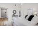 Bright bedroom featuring an ensuite bathroom, ceiling fan, and decorative mirror at 3860 Whiting Se Dr, St Petersburg, FL 33705