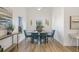 Stylish dining room features modern decor, including table, chairs, and lots of natural light at 3860 Whiting Se Dr, St Petersburg, FL 33705