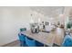 Bright dining area with stylish furnishings, lots of light, and an open concept layout to the kitchen at 3860 Whiting Se Dr, St Petersburg, FL 33705