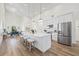 Bright and spacious kitchen with a large island, stainless steel appliances, and an adjacent dining area at 3860 Whiting Se Dr, St Petersburg, FL 33705