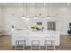 Bright kitchen boasts a large island with seating, stainless appliances, and recessed lighting at 3860 Whiting Se Dr, St Petersburg, FL 33705