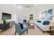 Bright living room features vaulted ceilings, modern furnishings, and a light neutral color palette at 3860 Whiting Se Dr, St Petersburg, FL 33705