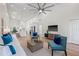 Spacious living room with bright, airy interior design and kitchen in the background at 3860 Whiting Se Dr, St Petersburg, FL 33705