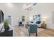 Bright living room featuring vaulted ceilings, modern furnishings, and light hardwood flooring at 3860 Whiting Se Dr, St Petersburg, FL 33705