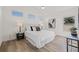 Cozy bedroom showcasing hardwood floors, natural light and a comfy bed with stylish decor at 3860 Whiting Se Dr, St Petersburg, FL 33705
