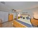 Bedroom featuring wood floors, ceiling fan, and light colored walls at 401 Dorchester Pl # 69, Sun City Center, FL 33573