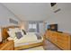 Cozy bedroom with wood flooring and comfortable decor at 401 Dorchester Pl # 69, Sun City Center, FL 33573