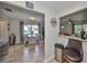 Open-concept living space with view into kitchen and dining room with a bar top at 401 Dorchester Pl # 69, Sun City Center, FL 33573