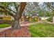 Charming home with mature trees and lush landscaping creating curb appeal at 401 Dorchester Pl # 69, Sun City Center, FL 33573