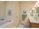 Inviting bathroom with a soaking tub, updated fixtures, and ample vanity space at 412 Pinewood Dr, Oldsmar, FL 34677