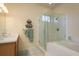 Modern bathroom boasts a glass-enclosed shower and a vanity sink with updated fixtures at 412 Pinewood Dr, Oldsmar, FL 34677