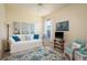Inviting bedroom featuring coastal themed decor, a day bed, and plenty of natural light at 412 Pinewood Dr, Oldsmar, FL 34677