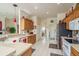 Traditional kitchen boasts tile floors, wood cabinetry, and plenty of counter space for meal preparation and serving at 412 Pinewood Dr, Oldsmar, FL 34677