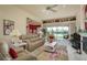 Bright living room with lake views, comfortable seating, and a colorful rug at 412 Pinewood Dr, Oldsmar, FL 34677