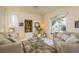 Cozy living room featuring neutral tones, comfortable seating, and lots of natural light at 412 Pinewood Dr, Oldsmar, FL 34677
