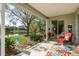 Enjoy the serene lake views from this covered patio with comfortable seating at 412 Pinewood Dr, Oldsmar, FL 34677