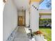 Inviting covered entryway with decorative stone and modern house numbers creating curb appeal at 4486 Gaston St, Spring Hill, FL 34607