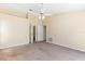 Large primary bedroom showcasing neutral walls and carpet, with doors to the ensuite at 4486 Gaston St, Spring Hill, FL 34607