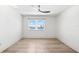 Bright bedroom with ceiling fan and window with water view at 517 Belle Isle Ave, Belleair Beach, FL 33786