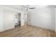 A bright bedroom with hardwood floors, ceiling fan and walk-in closet at 517 Belle Isle Ave, Belleair Beach, FL 33786