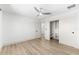 A bright bedroom with hardwood floors, ceiling fan and walk-in closet at 517 Belle Isle Ave, Belleair Beach, FL 33786