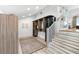 Large walk-in closet featuring custom shelving and storage with staircase to primary bathroom at 517 Belle Isle Ave, Belleair Beach, FL 33786