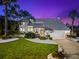 Beautiful home with manicured lawn and metal roof at 517 Belle Isle Ave, Belleair Beach, FL 33786