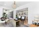Bright living space with access to outdoor area, and views of the kitchen and living room at 517 Belle Isle Ave, Belleair Beach, FL 33786
